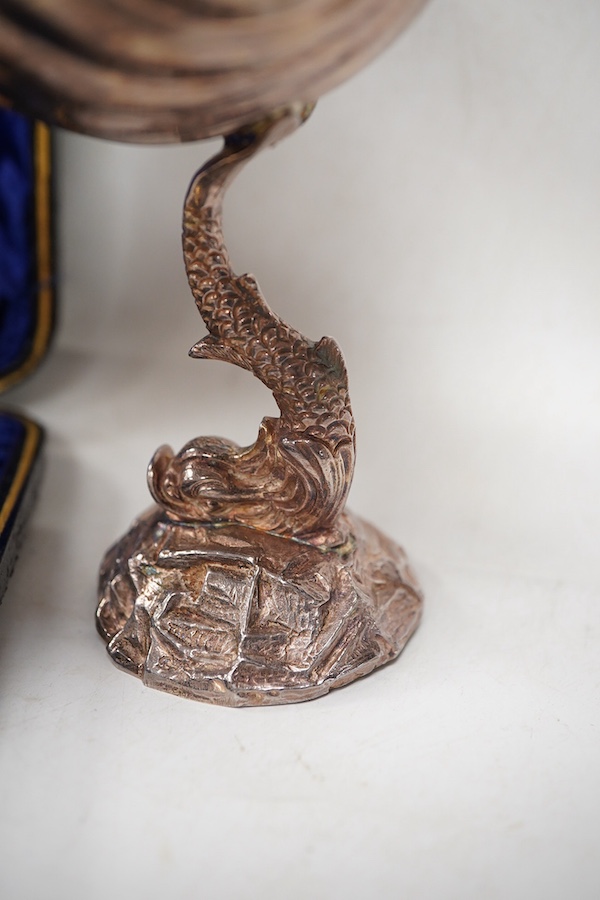 A modern silver shell dish on dolphin support, by Mappin & Webb, Sheffield, 1987, height 11cm, together with a cased set of six late Victorian parcel gilt silver apostle teaspoons, a 1960's small silver dish with Winston